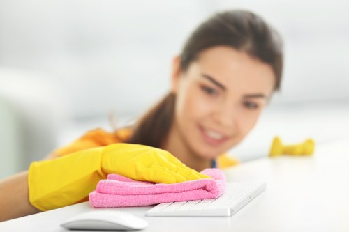 Local technician cleaning a lounge suite in Bayswater apartment